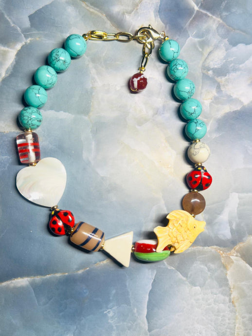 Necklace with natural turquoise and dyed howlite and colored crystal stones